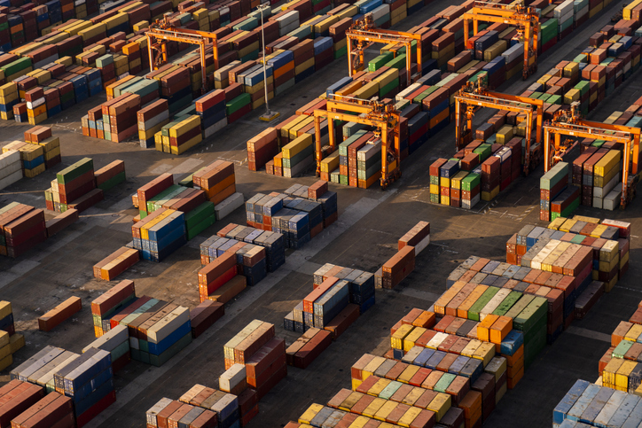 Shipping containers waiting in port. Image shot from birds-eye view.