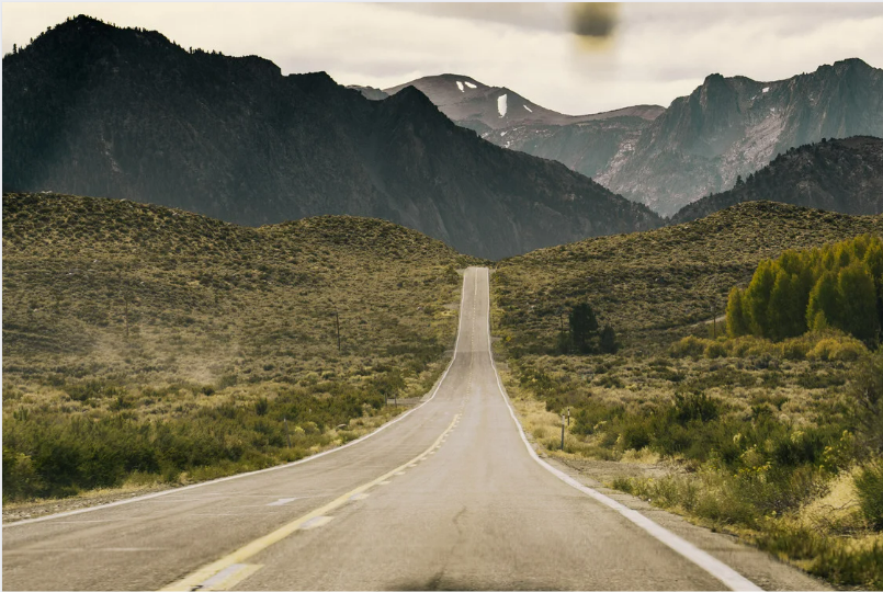 A road leading to mountains